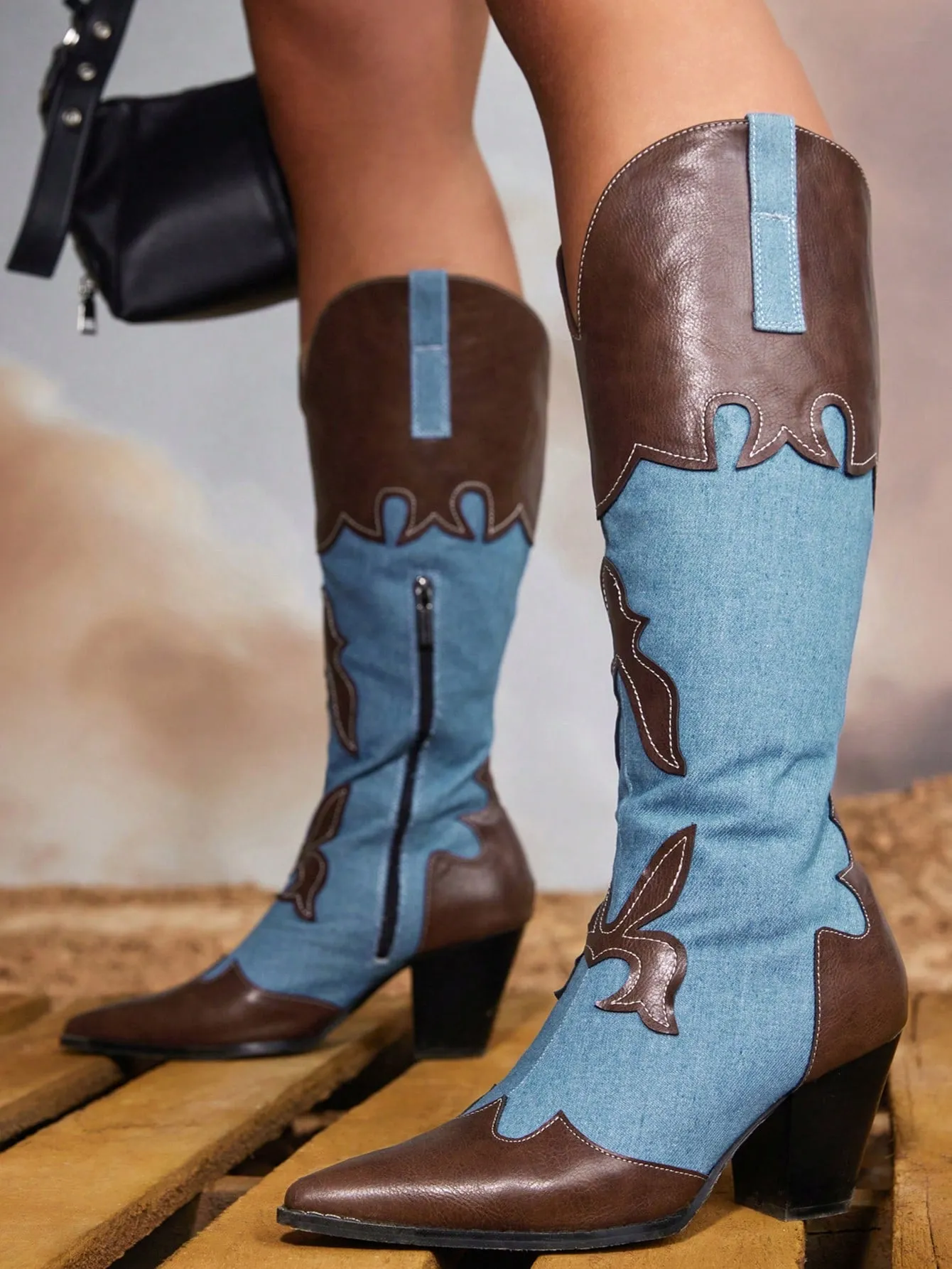 Fashionable and comfortable women's western boots with contrasting colors, pointed toe, and block heel