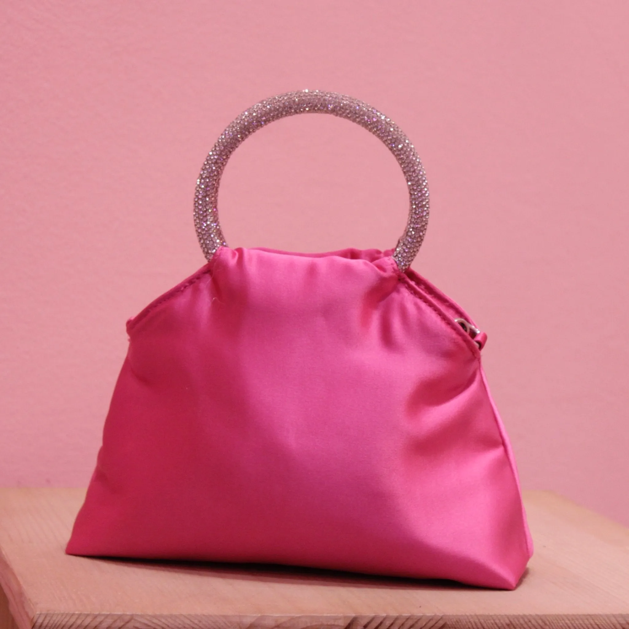 Fuchsia satin puffer bag with jewel handles