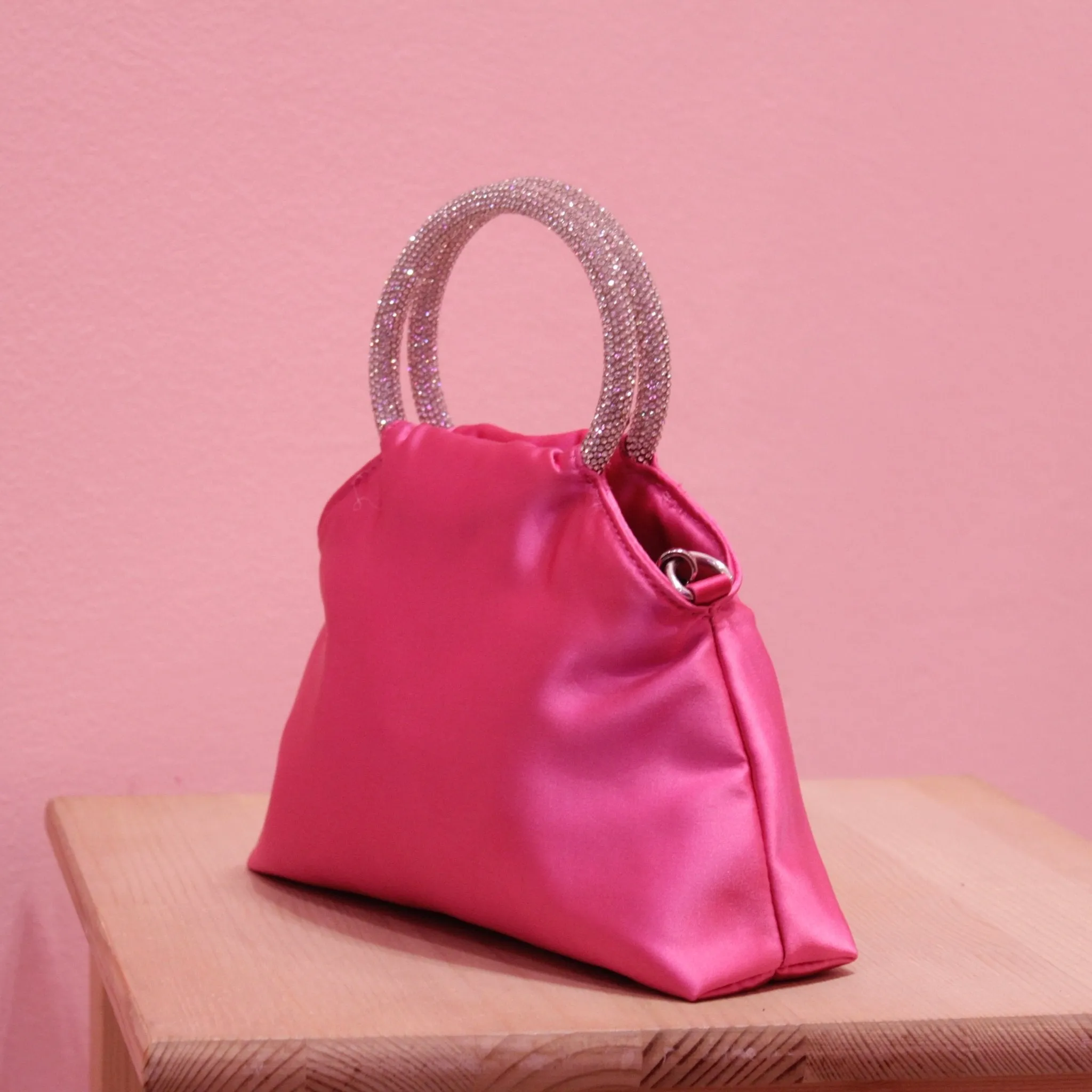 Fuchsia satin puffer bag with jewel handles