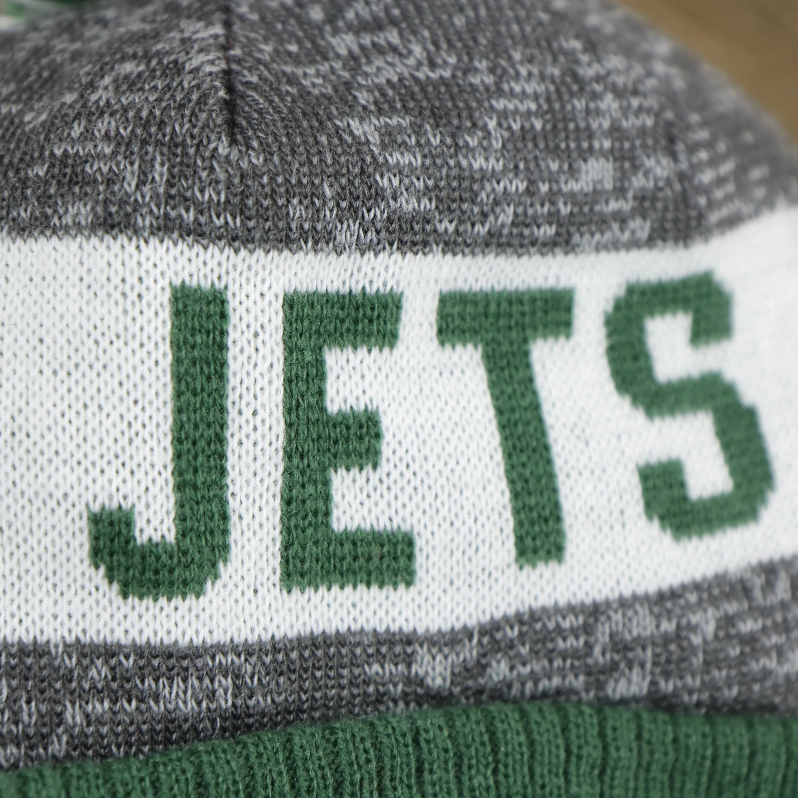 New York Jets Pom Pom Winter Beanie - Green and Gray, On-Field Striped Wordmark.