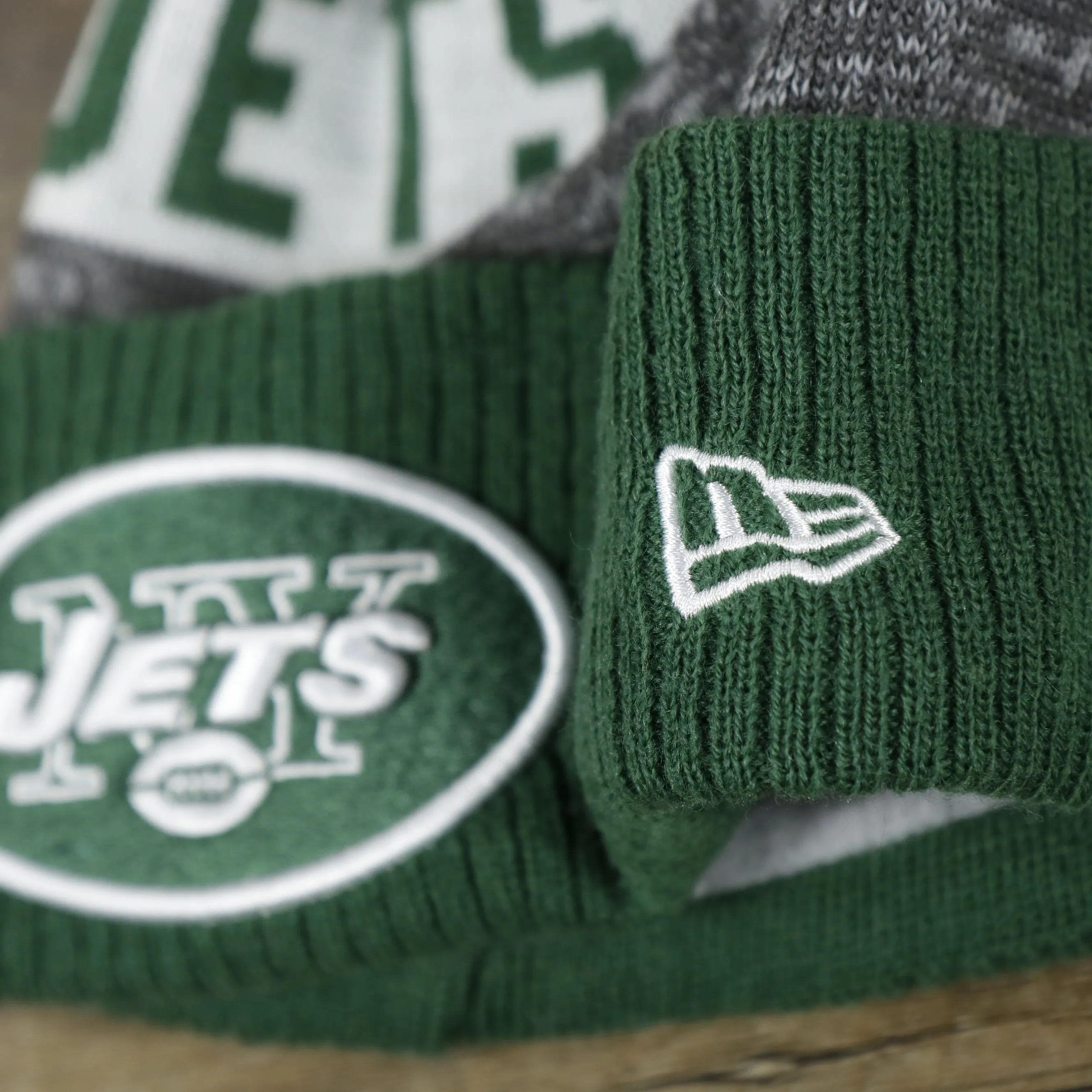 New York Jets Pom Pom Winter Beanie - Green and Gray, On-Field Striped Wordmark.